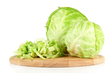 Green cabbage sliced on cutting board, isolated on white