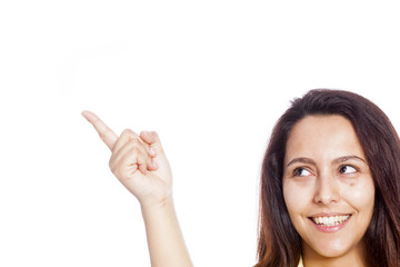 Portrait of a young beautiful woman pointing at copyspace
