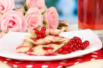 Tasty  sweet dumplings on white plate, on bright background