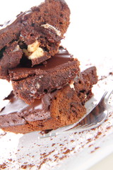 Slices of a brownie with white chocolate chunks