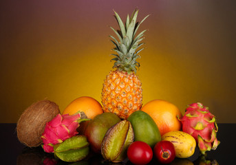 Composition of exotic fruits on colorful background