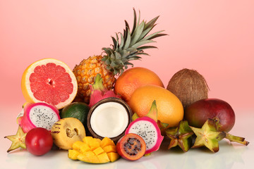 Composition of exotic fruits on red background © Africa Studio