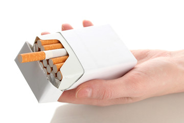 Woman hand with box of cigarettes, isolated on a white