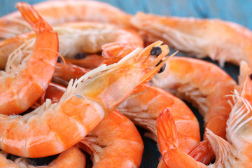 Shrimps on blue wooden table