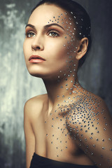 beautiful young girl with crystals on the body