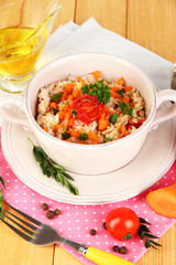 Delicious rice with vegetables and herbs in pot