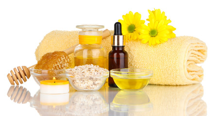 Fototapeta na wymiar Fragrant honey spa with oils and honey isolated on white