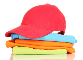 Red peaked cap with T-shirts isolated on white