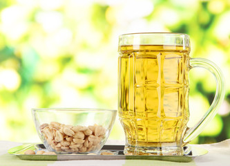Beer in glass and nuts