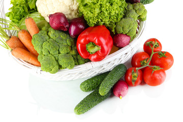 Fresh vegetables in white wicker basket close up