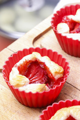 Triangle wraps of puff pastry with fresh ripe strawberries