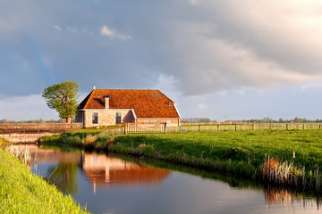 charming house by river in sunrise sunshine