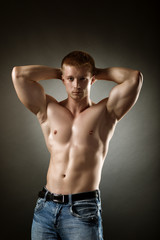 Fototapeta na wymiar Healthy muscular young man posing in studio