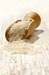 rice on a wooden shovel