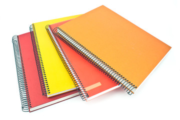 Stack of colorful spiral notebooks