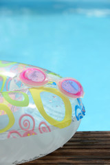 child buoy, goggles and swimming pool background