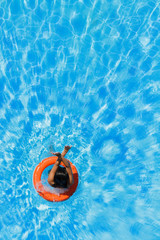 jumping in the buoy at the swimming pool