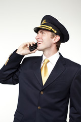 Young man in the form of a passenger plane pilot