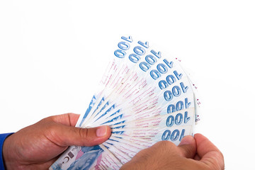Hands Holding Turkish Lira Banknotes