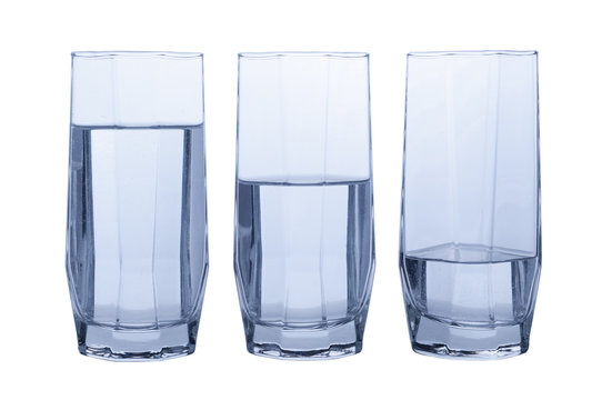 Three glasses of clear water.  Full, half and quater
