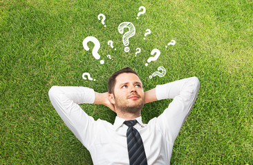 businessman with questions symbol
