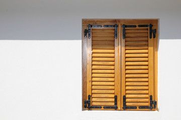 orange vintage window with shutters