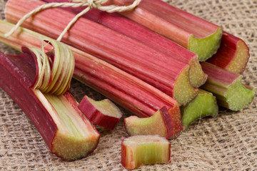 rhubarb stalks on jute background