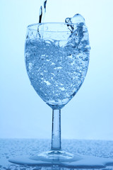 Pouring a Refreshing Drink in a Glass