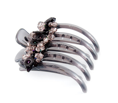 Black isolated barrette over white background. Fashion, object