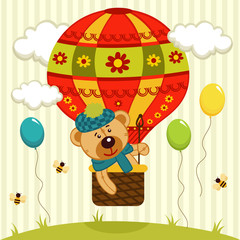 Obraz premium bear flies on air balloon