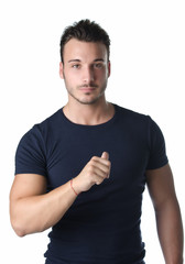 Obraz premium Handsome young man pointing thumb finger at himself