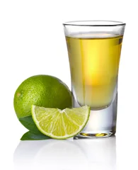 Foto op Canvas Gold tequila shot with lime isolated on white © Serhiy Shullye