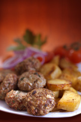 meatballs served with potatoes