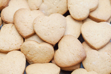 Fototapeta na wymiar Freshly baked cookies in heart shapes