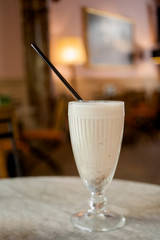 Tasty milkshake on a wooden table