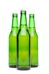 Three green beer bottles.