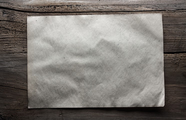 paper on wooden background