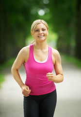 Portrait of an active young woman jogging in the park