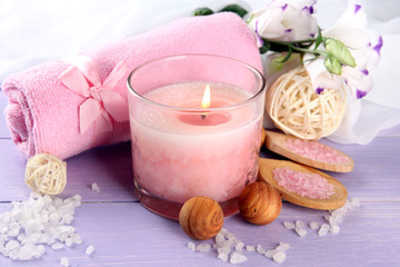 Beautiful spa setting with pink candle and flowers