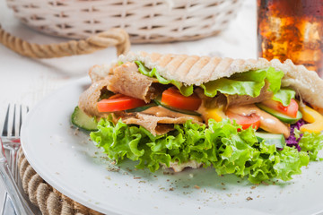 Kebab in pita bread close-up