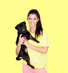 Obraz premium Brunette girl with her pug dog