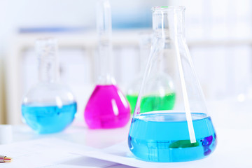 Chemistry laboratory glassware with colour liquids