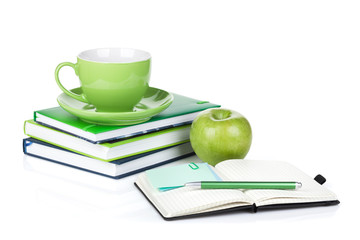 Ripe green apple, coffee cup and office supplies