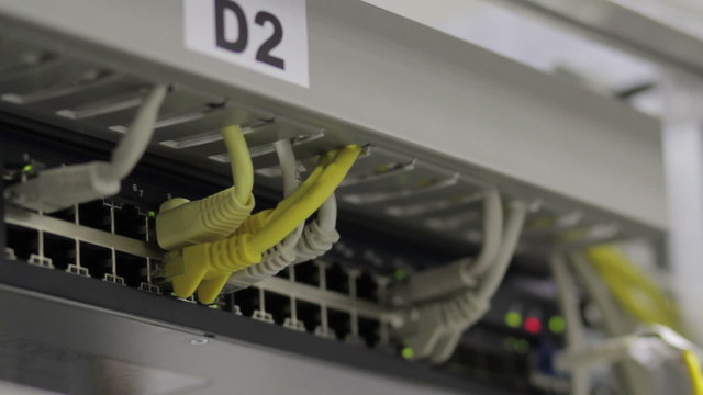 connected switches in technology room with patch cables