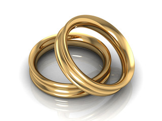 Fototapeta premium couple of gold wedding rings on white background