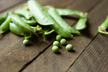 green peas on wooden boards