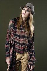 Portrait of fashionable girl with hat posing