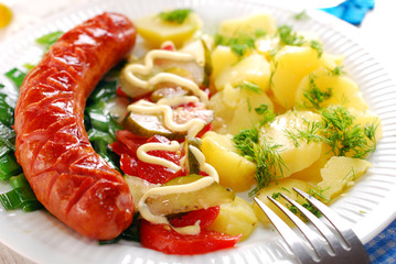 grilled sausage,vegetable salad and potato