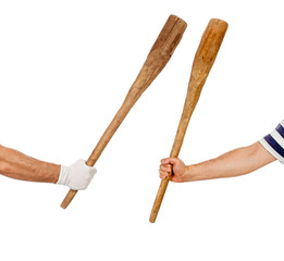 Two hands holding bats
