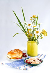 still life with  colors by a roll by a merry and red currant